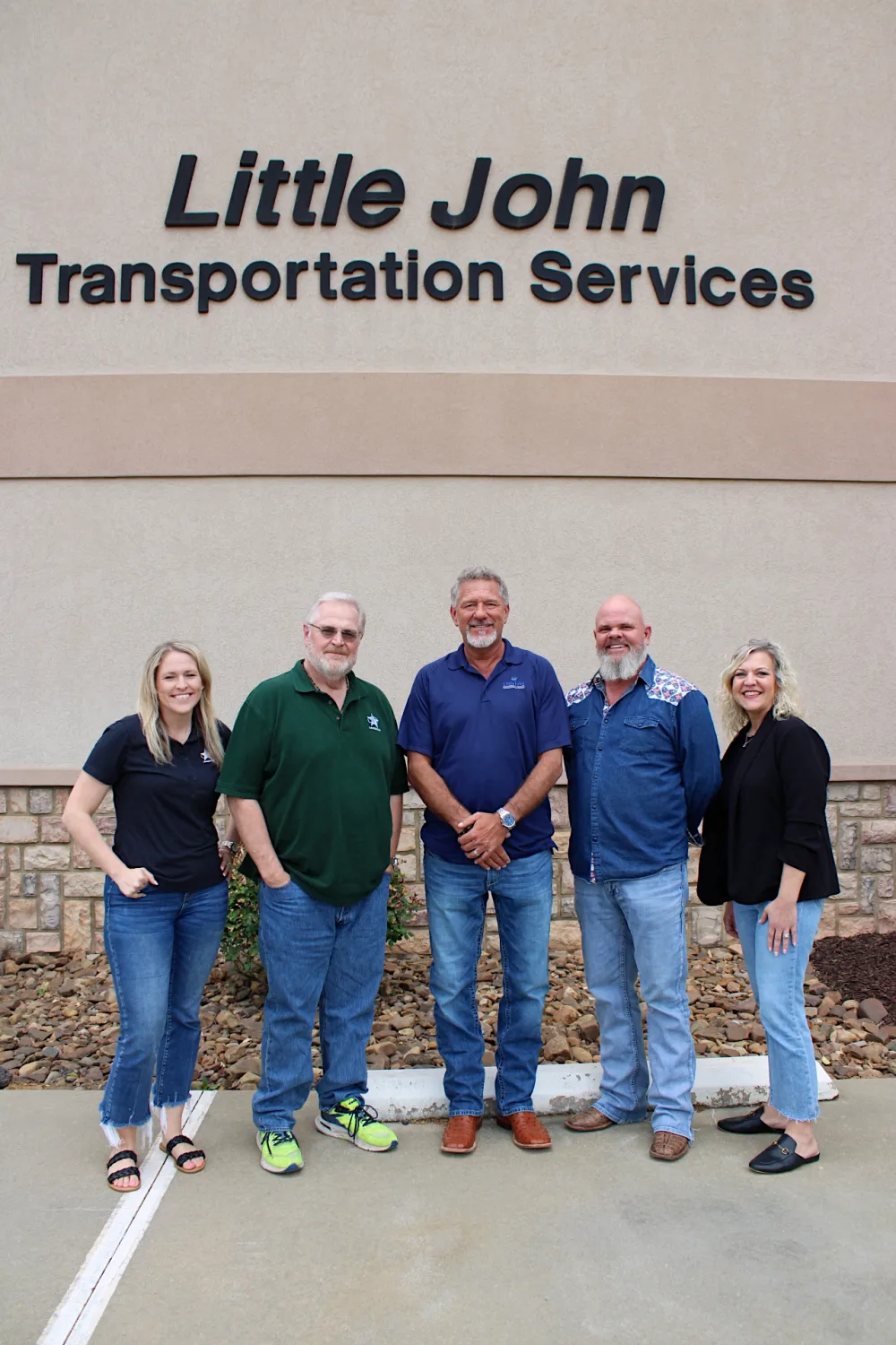 The Little John Transportation Services leadership team outside the headquarters.