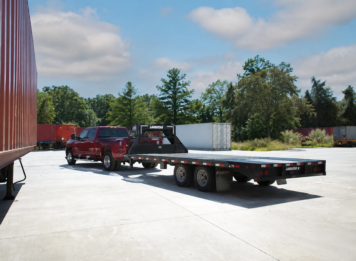 Hot-shot pickup with flatbed trailer ready for an urgent run.